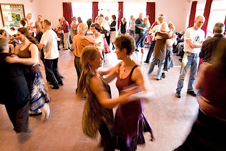 A room full of dancers, dancing in couples